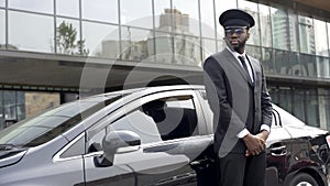 Driver of luxury taxi service waiting his very important person, ready to go