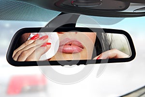 Driver make a makeup in car