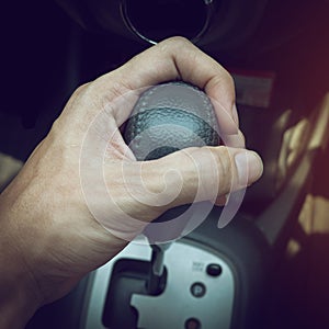Driver man hand holding automatic transmission