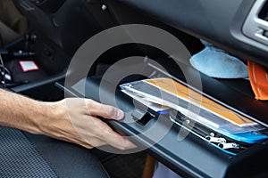 Driver Opening Glovebox Compartment