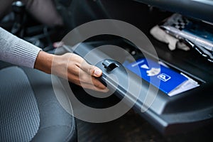 Driver Opening Glovebox Compartment