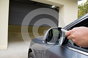 Driver opens the garage with remote control