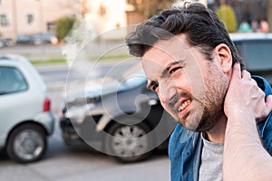 Driver portrait feeling pain after car accident