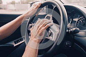 Driver presses the horn of the car to attract the attention of the car bully and avoid road accident. Stress and aggressive