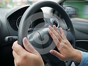 Driver Pressing Car Horn