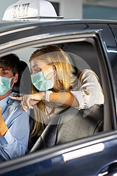 Driver in public trasportation taxi wearing face protection mask to prevent disease pandemic