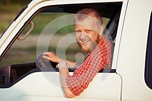 Driver in a red shirt while driving