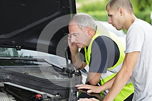 Driver on road having problem with car