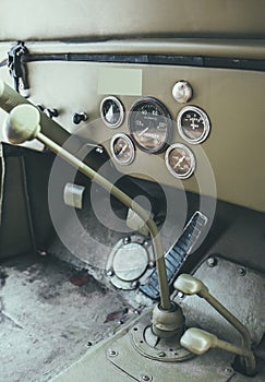 Driver's cabin of an old 4x4 vehicle.