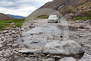 Driver sitting in car for driving on mountains river