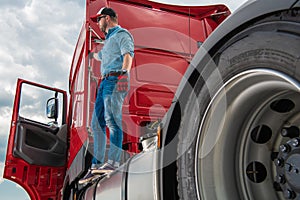 Driver Standing on a Semi Tractor Truck