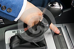 The driver to turn on the thumb switch the engine off button for driving in traffic jams on the road