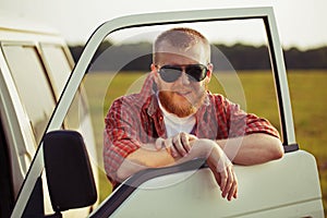 Driver of a truck in sunglasses