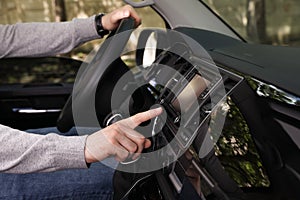 Driver using modern car navigation system, closeup