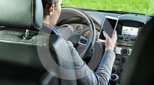 Driver using smartphone and gps navigation in a car