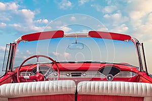 Driver view of a red vintage classic open American cabriolet car