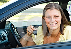 Driver woman smiling showing new car keys