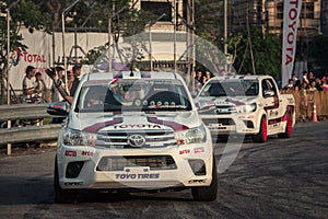 Drivers waving hand to the audience after show