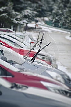 Drivers who lift their windshield wipers up to prevent freezing in a snowy area