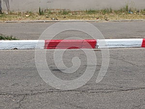 Driveway, sidewalk and curb red-white