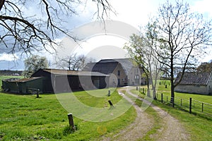 Backsite of a farm on a clouded day in spring