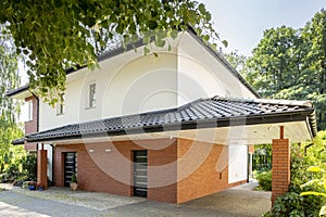 Driveway to garage of red brick house