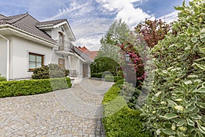 Driveway to mansion with garden