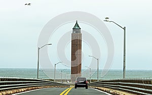Driviing down the Robert Moses bridge looking at water tower and ocean