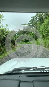 Driving 4WD SUV down rocky hill countryside Costa Rica