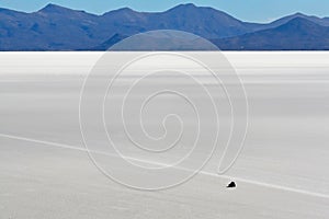 Driving across the salt flats at Uyuni