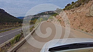 Driving along the karstic cliffs in large lagoon of Tobar at Hoz de Beteta, Cuenca, Castilla la Mancha, Spain