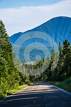 Driving along lake mcdonald roads in glacier national park montana photo