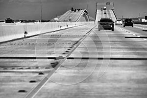 Driving along Louisiana interstate on a sunny day, car traffic