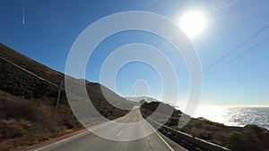 Driving campers in Big Sur California Cabrillo Highway 1 coast road, pov south