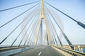 Driving car along the Guadiana International Bridge photo