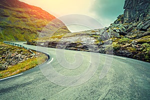 Driving a car along a winding mountain road