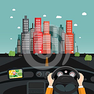 Driving car design - hands on steering wheel, gps navigation and cars on asphalt road, city on background