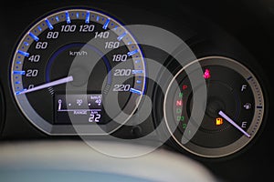 Driving car with digital oil gasoline level sign on the panel dashboard indicates