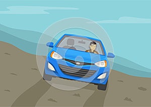 Driving a car on a grades and hills. Off road vehicle roll angle. Front view of a blue sedan car on a hill.