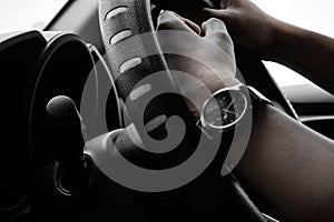 Driving a car hands on steering wheel