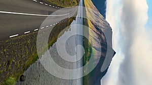 Driving a car in Iceland. Iceland road. Aerial vertical, vertical video background.