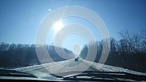 Driving car in icy road. Dangerous road. Winter scenery