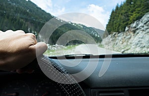 driving car on the mountain road. Montenegro in a cheap car