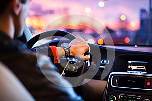 Driving a car at night -man driving his modern car at night