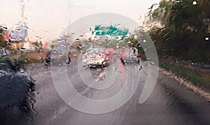 Driving a car in the rain storm