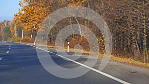 Driving a car at rural countryside at fall season