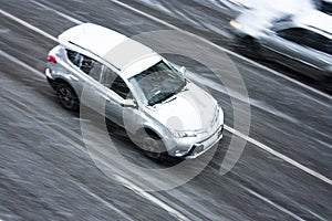 Driving car on the snowy city street