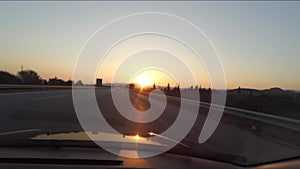 Driving car at sunset through a highway in Turkey. Car dashboard POV view. Travel concept. View from inside a car