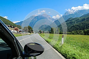 Driving the car towards the alpine valley
