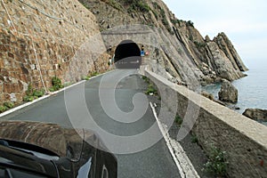 Driving the car towards the narrow coastline photo